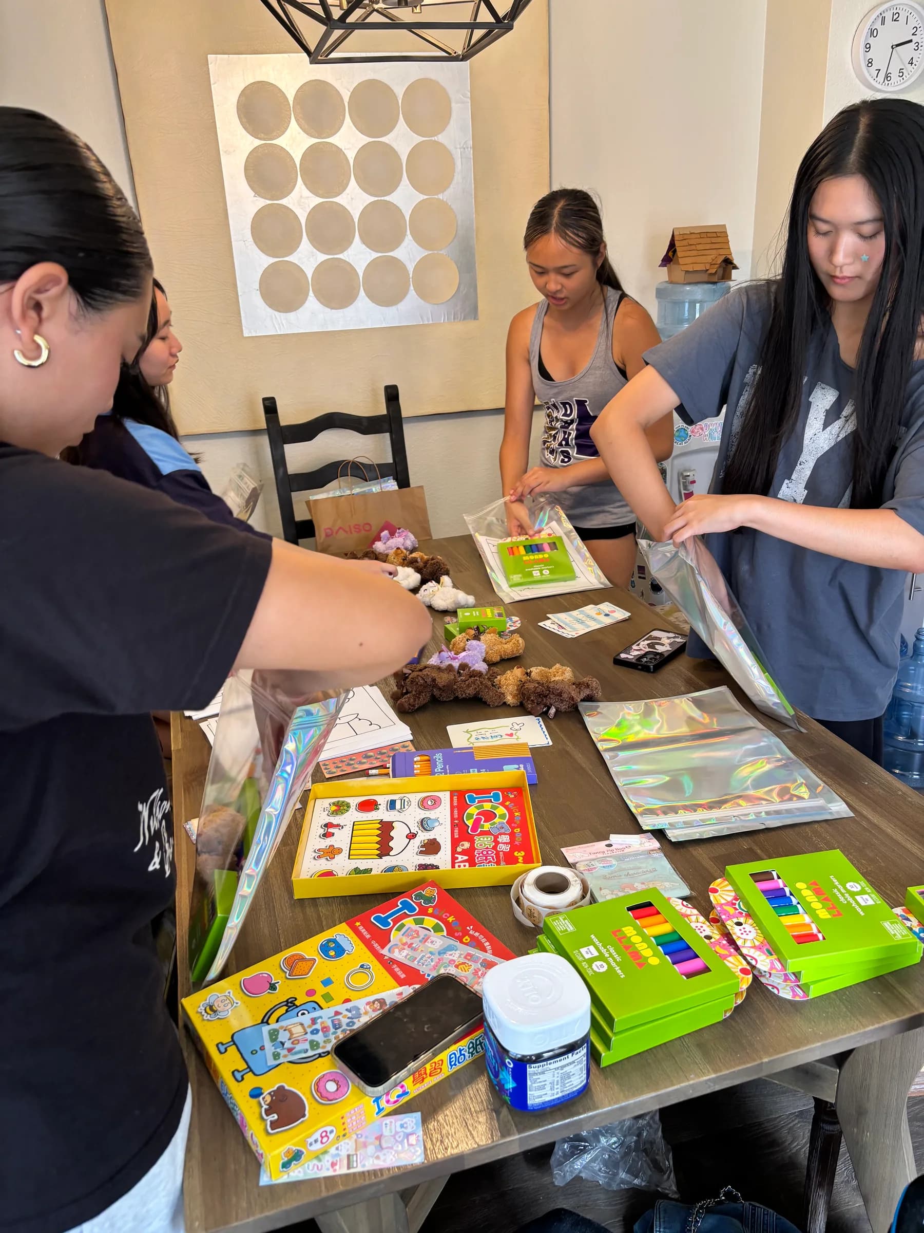 Members packing Colors of Hope art kits together